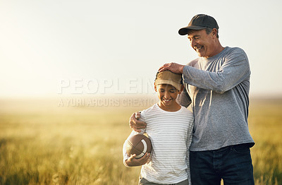 Buy stock photo Father, son and rugby ball in a countryside field for bonding and fun in nature. Mockup, dad and young child together with happiness and smile ready to start American football game outdoor on farm