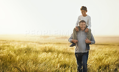 Buy stock photo Shot of a mature man carrying his son on his neck