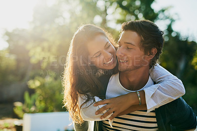 Buy stock photo Shot of an affectionate young couple bonding outdoors