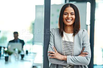 Buy stock photo Portrait of a confident businesswoman standing in an office