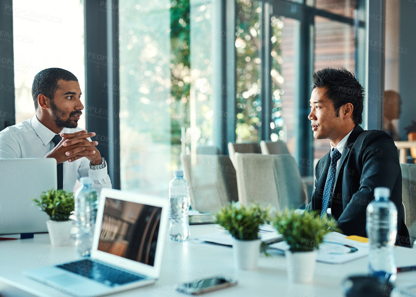 Buy stock photo Office, business people and thinking in meeting for discussion, feedback and investment performance. Boardroom, corporate career and men with conversation for project, negotiation and partnership