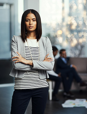 Buy stock photo Portrait of a businesswoman posing in her office with her arms crossed