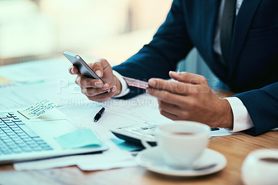 Buy stock photo Shot of an unidentifiable businessman making a credit card payment online