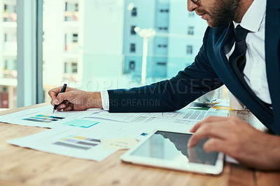 Buy stock photo Shot of an unidentifiable businessman working in an office