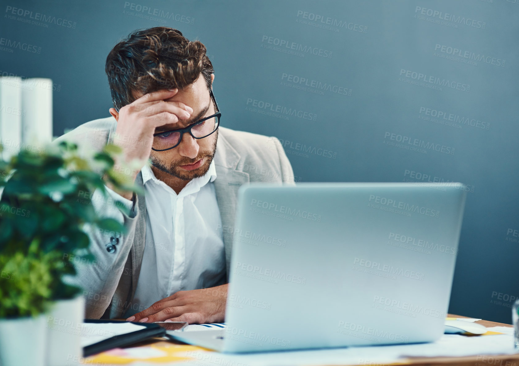 Buy stock photo Laptop, glasses and man with headache in office for pain, fatigue or anxiety in finance job. Business, person and frustrated with stress by technology for investment, inflation or stock market crisis