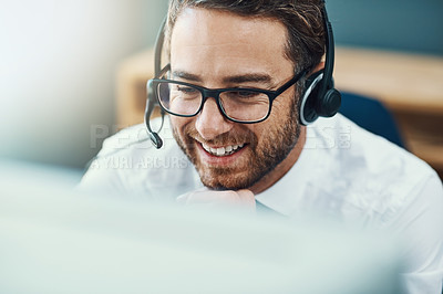 Buy stock photo Shot of a call centre agent working in an office
