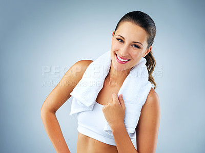 Buy stock photo Studio shot of a beautiful and healthy young woman against a blue background