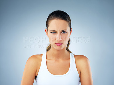 Buy stock photo Studio shot of a beautiful and healthy young woman against a blue background