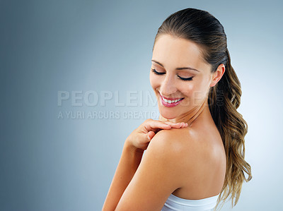 Buy stock photo Skincare, beauty and woman in studio with natural, hand and touch with collagen skin routine. Health, glow and face of female person with dermatology treatment by blue background with mockup space.