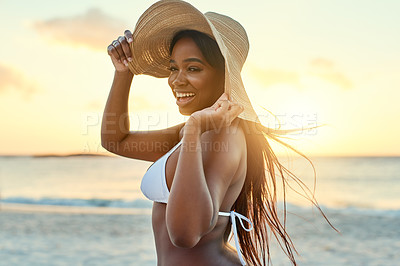 Buy stock photo Shot of a beautiful young woman in a bikini on the beach