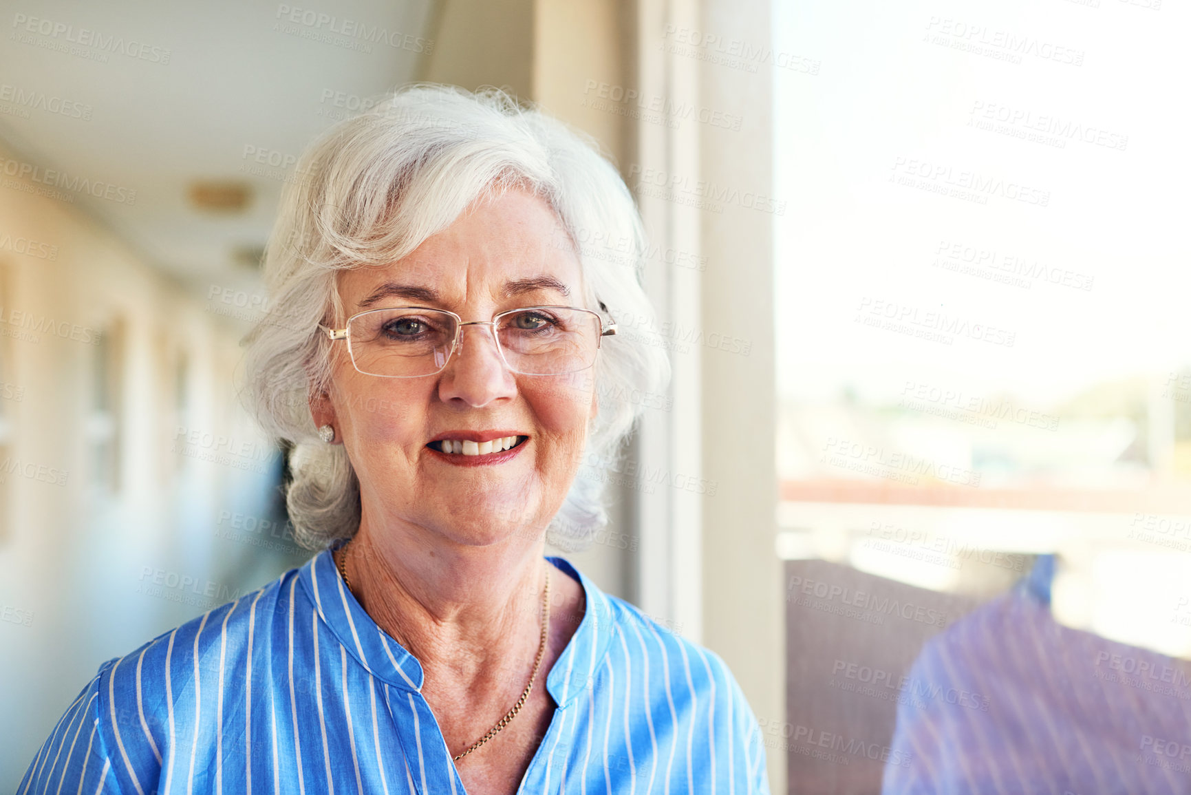 Buy stock photo Glasses, smile and portrait of senior woman by window in home with positive attitude for retirement. Happy, memory and elderly female person from Ireland with dementia remembering past at house.