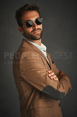 Buy stock photo Portrait, man and fashion for confident in studio with stylish, trendy and smart luxury clothes for business. Pride, male person and arms crossed with designer glasses, suit and grey background