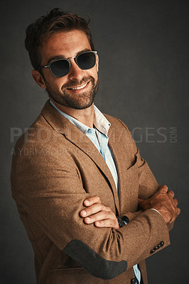 Buy stock photo Smile, man and fashion for confident in studio with stylish, trendy and smart luxury clothes as Professor. Pride, male person and portrait arms crossed, designer glasses, elegant and grey background