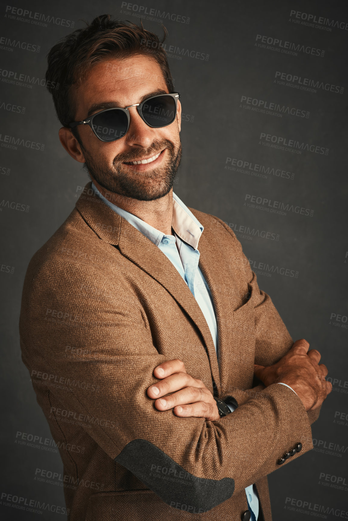 Buy stock photo Smile, man and fashion for confident in studio with stylish, trendy and smart luxury clothes as Professor. Pride, male person and portrait arms crossed, designer glasses, elegant and grey background