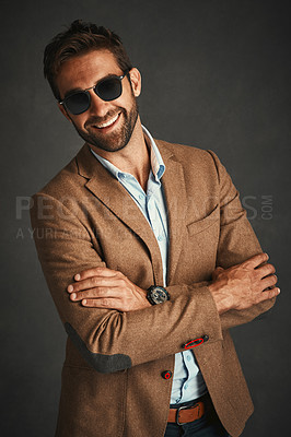 Buy stock photo Studio shot of a handsome young man posing against a gray background