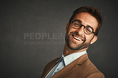 Buy stock photo Studio shot of a handsome young man posing against a gray background