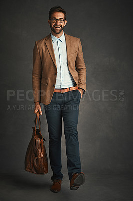 Buy stock photo Man, portrait and studio with smile for fashion, bag and smart casual style for professional confidence. Male professor, gray background and glasses with jacket or cool, trendy blazer in Chicago