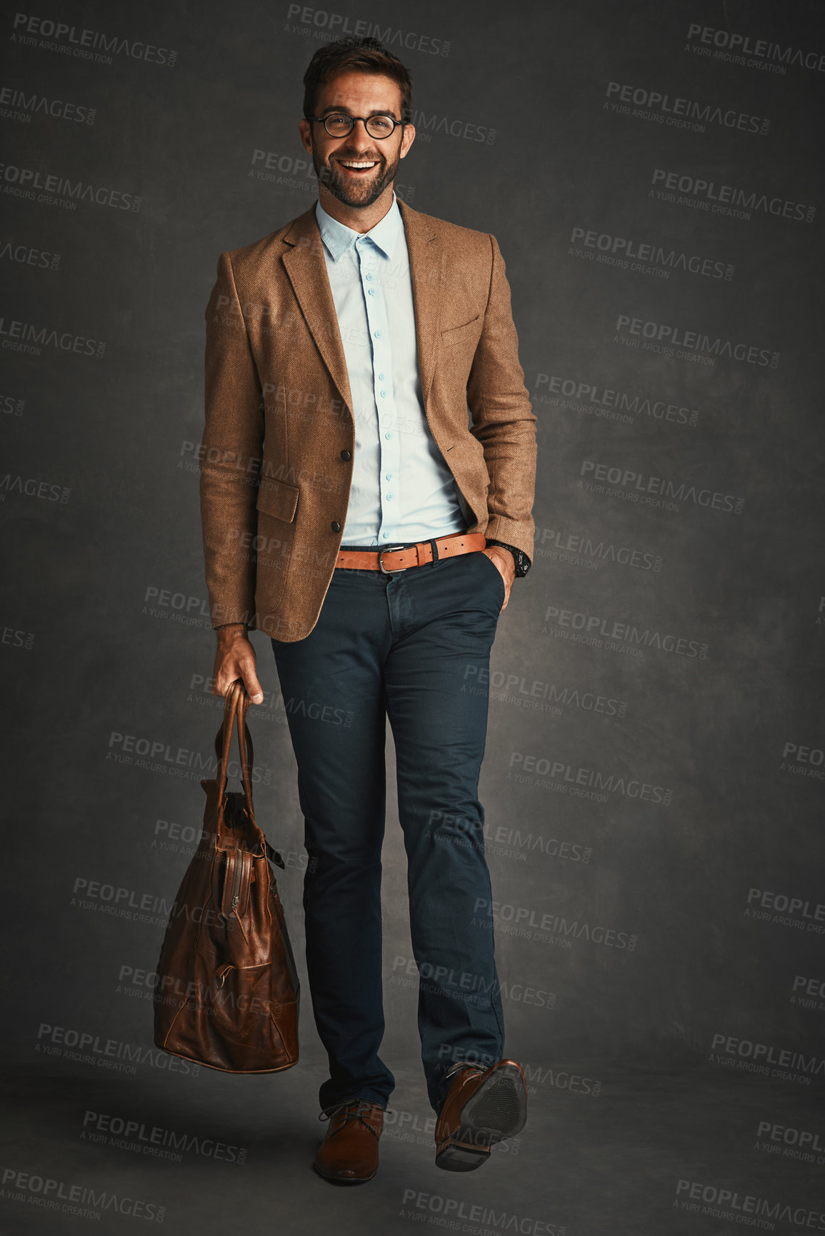 Buy stock photo Man, portrait and studio with smile for fashion, bag and smart casual style for professional confidence. Male professor, gray background and glasses with jacket or cool, trendy blazer in Chicago