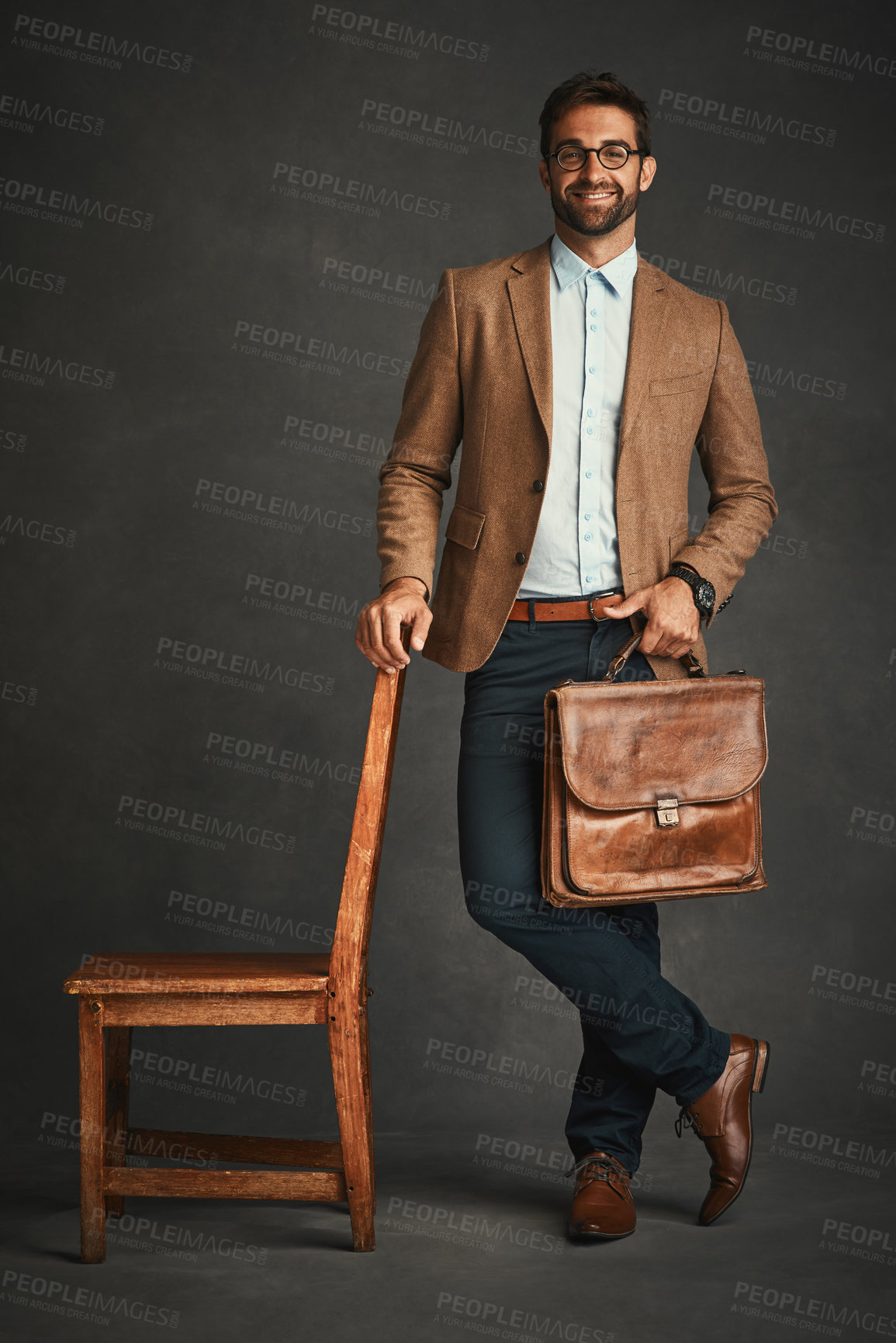 Buy stock photo Chair, portrait and space with professor man in studio on dark background for college lecture. Briefcase, education and glasses with confident university teacher on mockup for development or learning