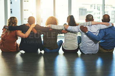 Buy stock photo Rearview shot of a group unrecognizable friends holding each other while looking through a window