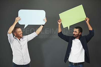 Buy stock photo Studio shot of men holding a speech bubble against a gray background