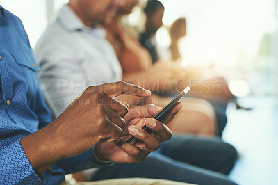 Buy stock photo Internet, chatting and a man texting on a phone while waiting in line in an office lobby. Man connected to free wifi browsing the web for a website or social media app and reading fake news