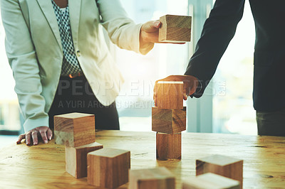 Buy stock photo Teamwork, man and woman in office with building blocks, design ideas and problem solving challenge. Engineering, planning and strategy, wood block game and team of business people working together.