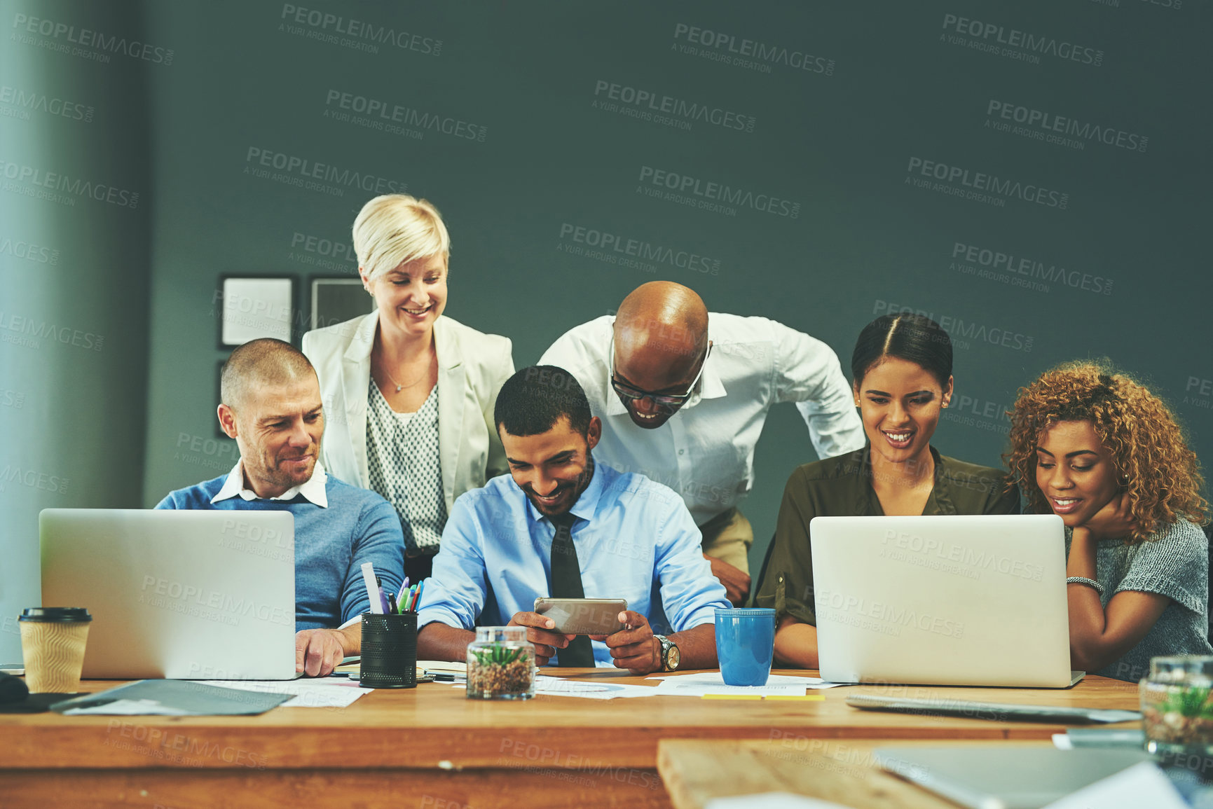 Buy stock photo Happy business people, meeting and technology with team for collaboration, ideas or software at office. Group of employees working together on laptop for project, research or development at workplace