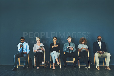 Buy stock photo Business people, recruitment and waiting in line with technology for hiring process and employment opportunity. Diverse group, job seeker and sitting in row for HR meeting with mockup space or banner