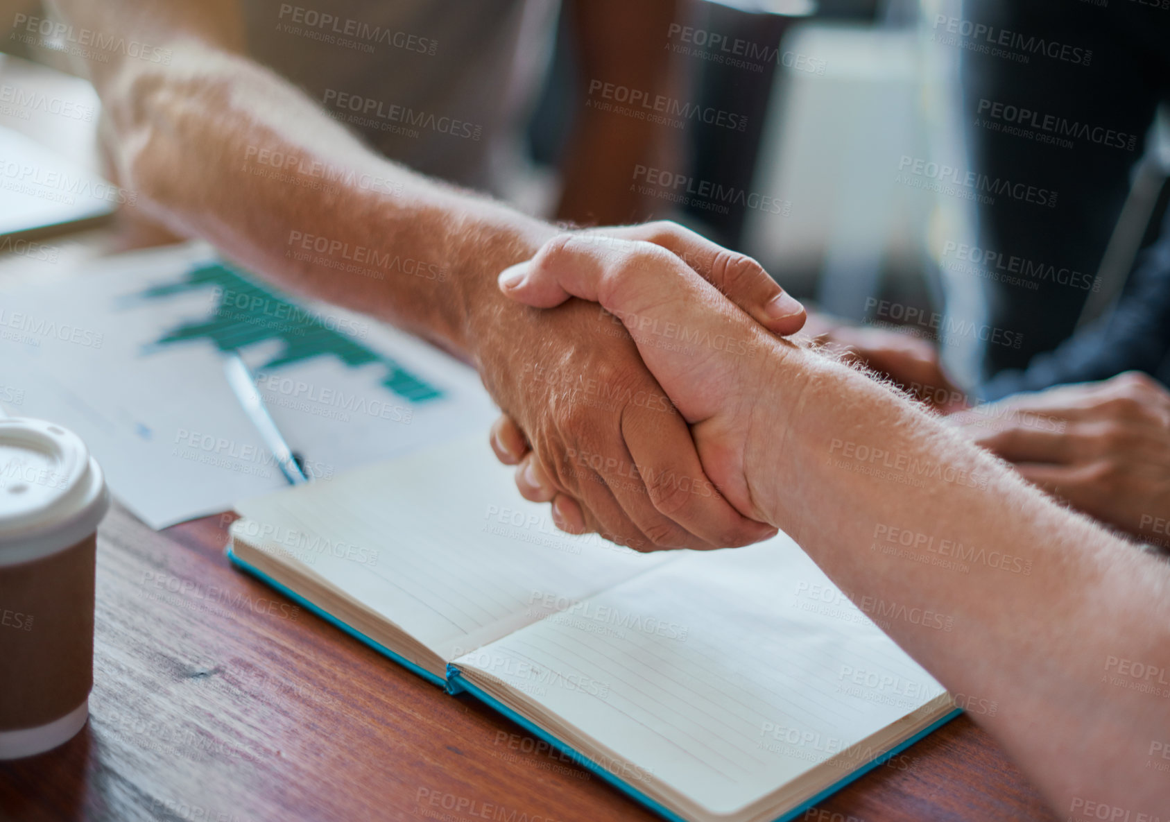 Buy stock photo Shot of two unrecognisable businesspeople shaking hands in an office