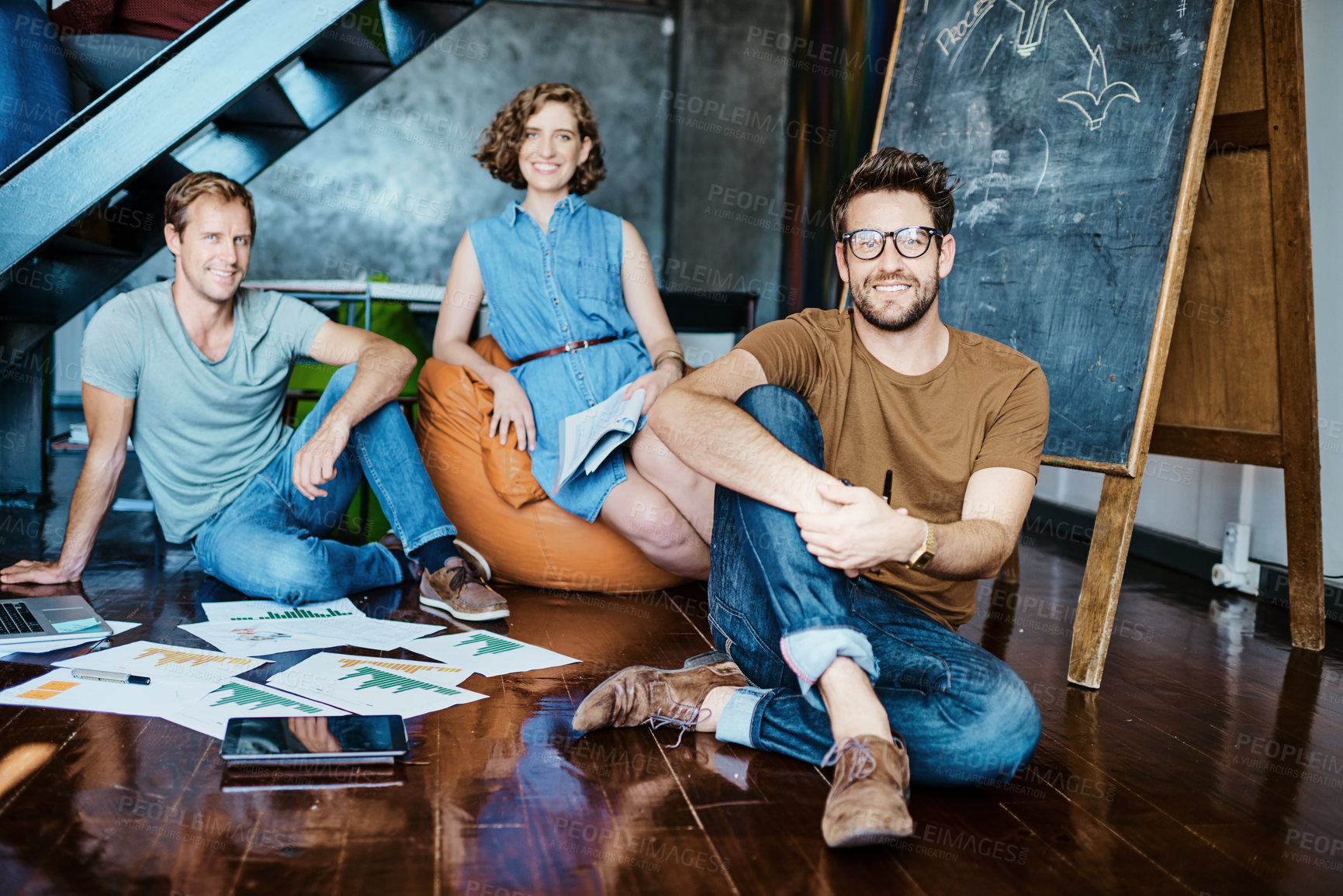 Buy stock photo Portrait of a group of young designers sitting in an office