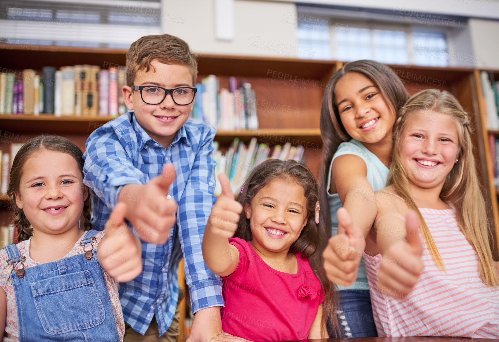 Buy stock photo Happy children, portrait or students with thumbs up in library for review or feedback in learning or education. School, vote or group of proud kids with like, yes sign or OK for agreement or teamwork