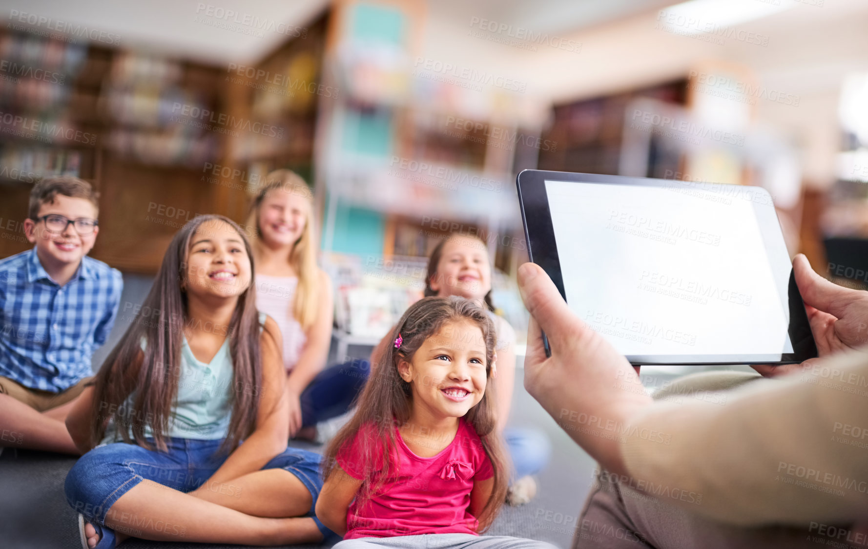 Buy stock photo Tablet, screen and teacher with children in library for language game, app and interactive activity. Creative, learning and person with mockup on tech for education, support and teaching at school