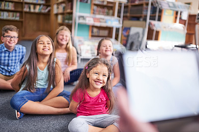 Buy stock photo Shot of a group of young children having a lesson at school