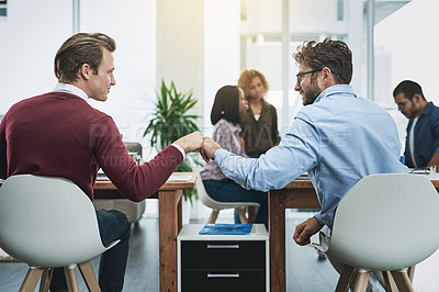 Buy stock photo Friends, collaboration and fist bump with business people in their office, working together on a company project. Motivation, teamwork and congratulations with colleagues celebrating success at work