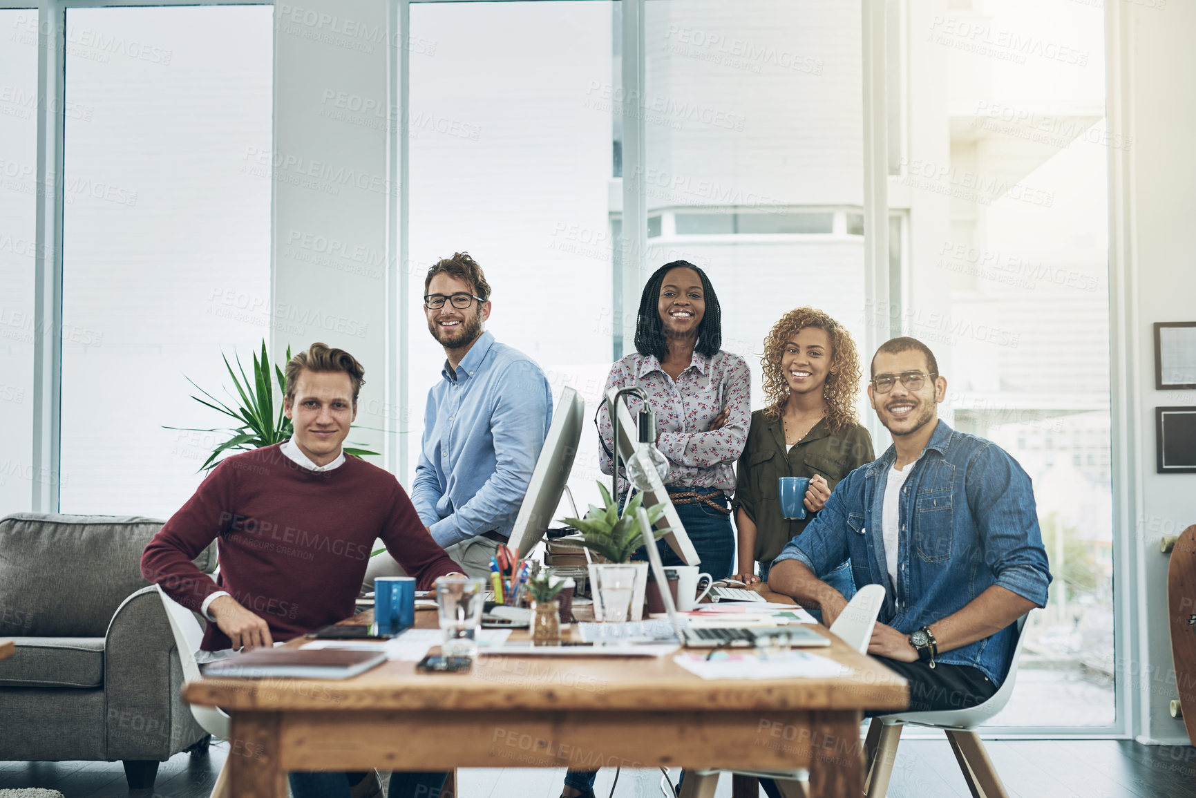 Buy stock photo Portrait of a team of young go getters working in a modern office