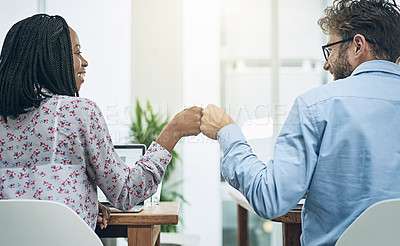 Buy stock photo Back, teamwork and fist bump with business people in their office, working together on a company project. Motivation, collaboration and hand gesture with colleagues celebrating success at work