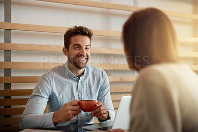 Buy stock photo Shot of a young couple bonding in a cafe
