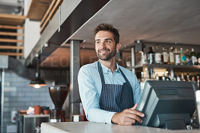 Buy stock photo Shot of a young entrepreneur working in a cafe