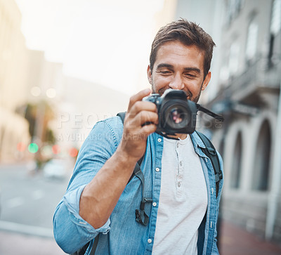 Buy stock photo Camera, city and tourism with photographer man outdoor for adventure, sightseeing or travel. Memories, smile and street with happy tourist in urban town for holiday, photography or vacation abroad