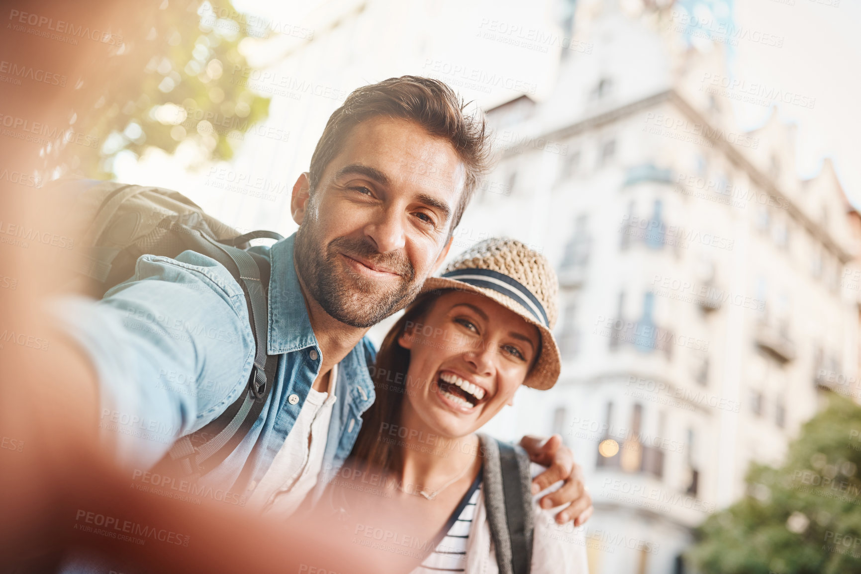 Buy stock photo Shot of a happy couple taking a selfie while out in a foreign country