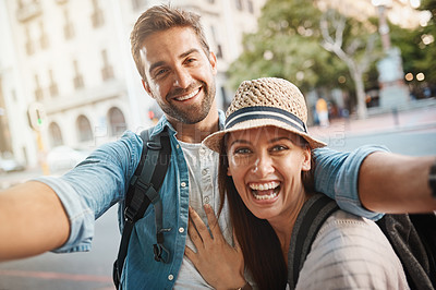Buy stock photo Happy couple, tourist and selfie in a city for travel on street with holiday memory and happiness. Portrait of man and woman outdoor on urban road for adventure, social media or vacation photo