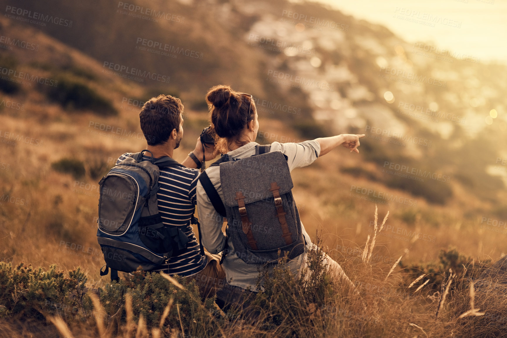 Buy stock photo Shot of a couple taking a break while out on a hiking trip
