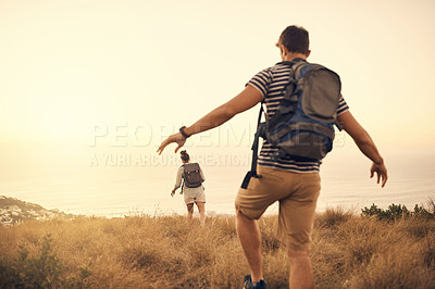 Buy stock photo Rearview shot of a couple out hiking