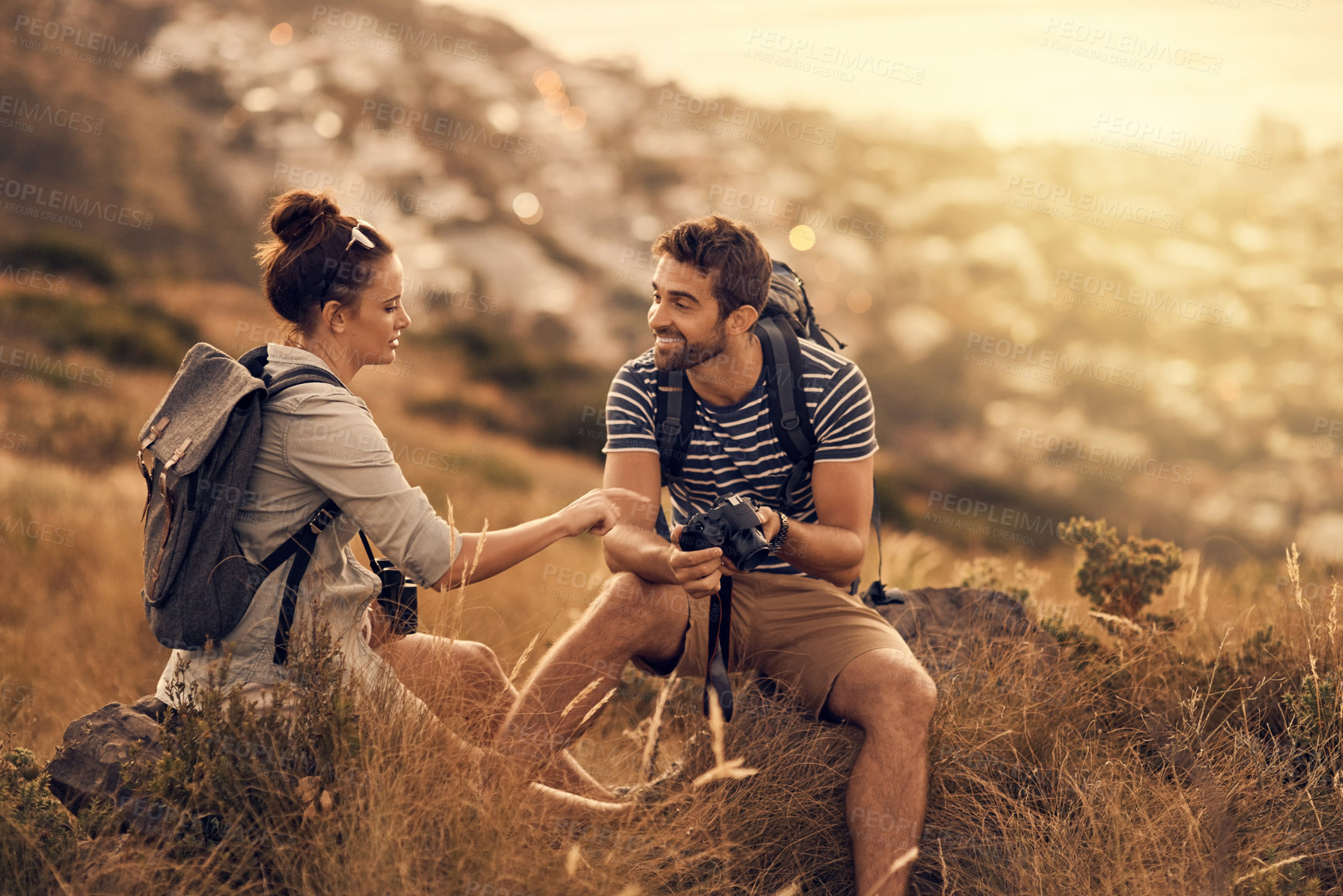 Buy stock photo Happy couple, hiking and outdoor for exploration, photography and nature with travel, adventure or bonding. People, camera and countryside for discovery, journey and backpack for recreation with gear