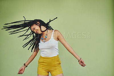 Buy stock photo Happy, dance and freedom with black woman in studio for energy, natural and hip hop. Happiness, talent and culture with african female dancer on green background for mockup, motivation and crazy
