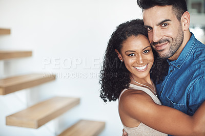 Buy stock photo Hugging, love and affection couple loving, happy and smiling. Interracial boyfriend and girlfriend bonding together, dating and feeling positive. Portrait of cheerful married man and woman embracing
