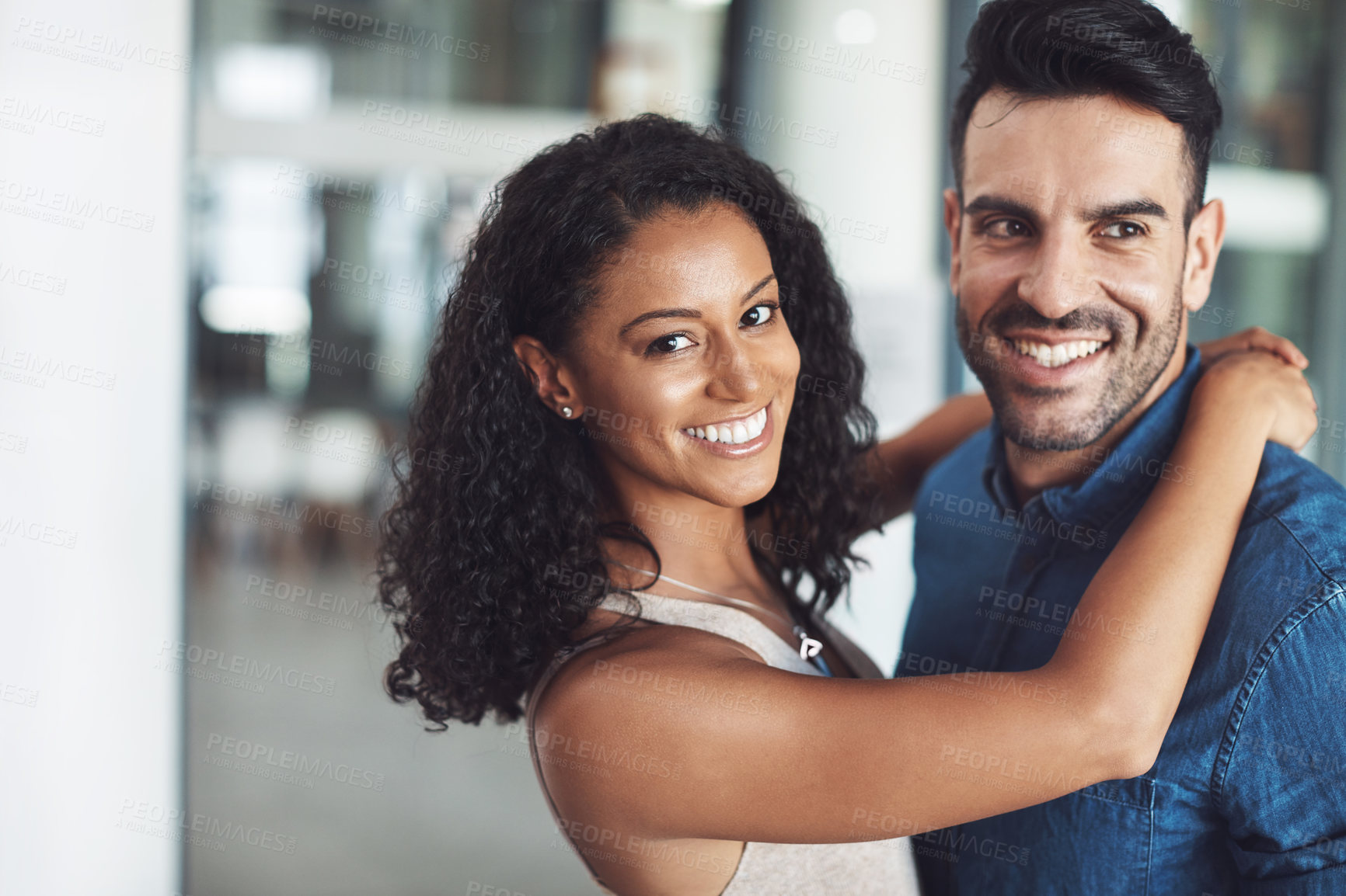 Buy stock photo Hugging, love and affection couple loving, happy and smiling. Diverse boyfriend and girlfriend bonding together, dating and feeling positive. Married people traveling on honeymoon