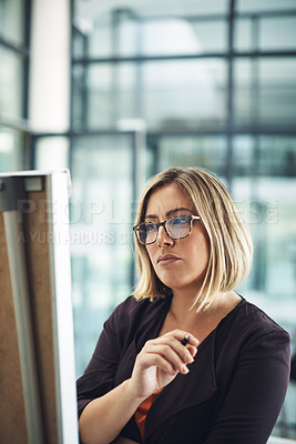 Buy stock photo Businesswoman thinking, planning and brainstorming while looking thoughtful and writing ideas on an office whiteboard. Female entrepreneur working on a plan and strategy to achieve marketing success