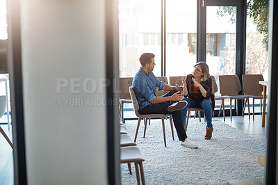 Buy stock photo Talking, planning or meeting team of colleagues brainstorming ideas, discussing strategy and sharing plans in office. Confident and serious business woman discussing and explaining to male coworker